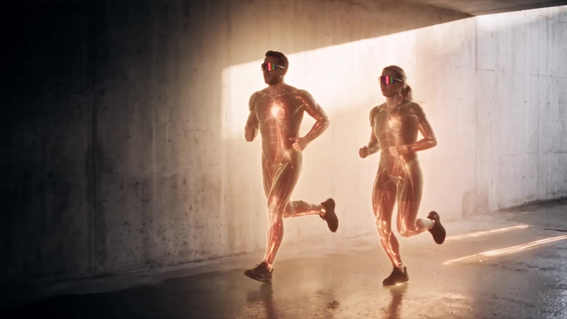 Two runners in a concrete underpass; their bodies, auras and light trails change colour through six recovery states until their kit rebuilds into a mint-lit performance suit